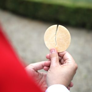 person holding brown round ornament